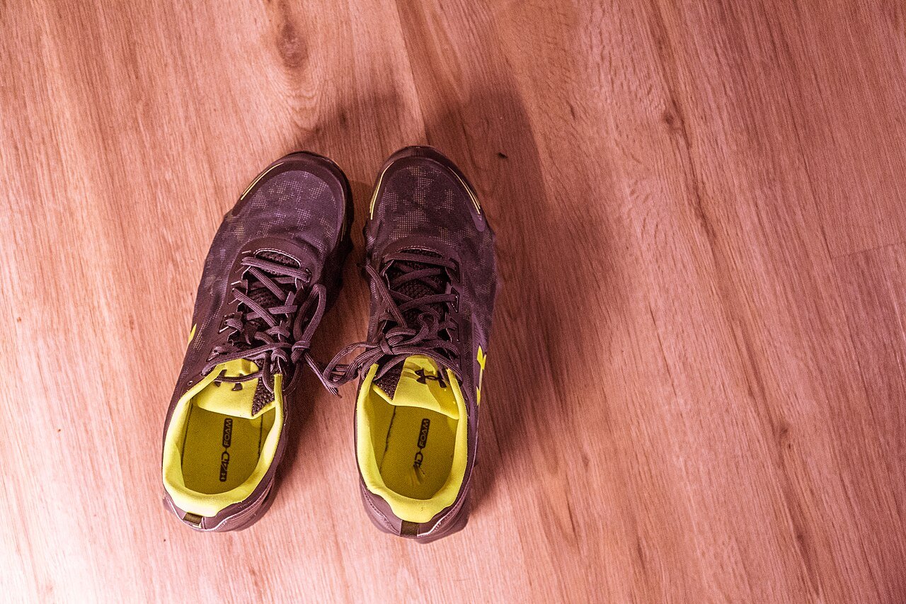 A pair of running shoes ready by the door
